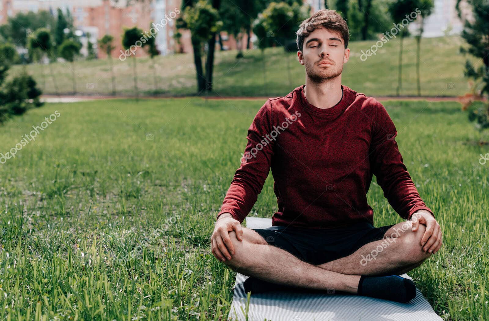 depositphotos 381821650 stock photo handsome young man meditating while